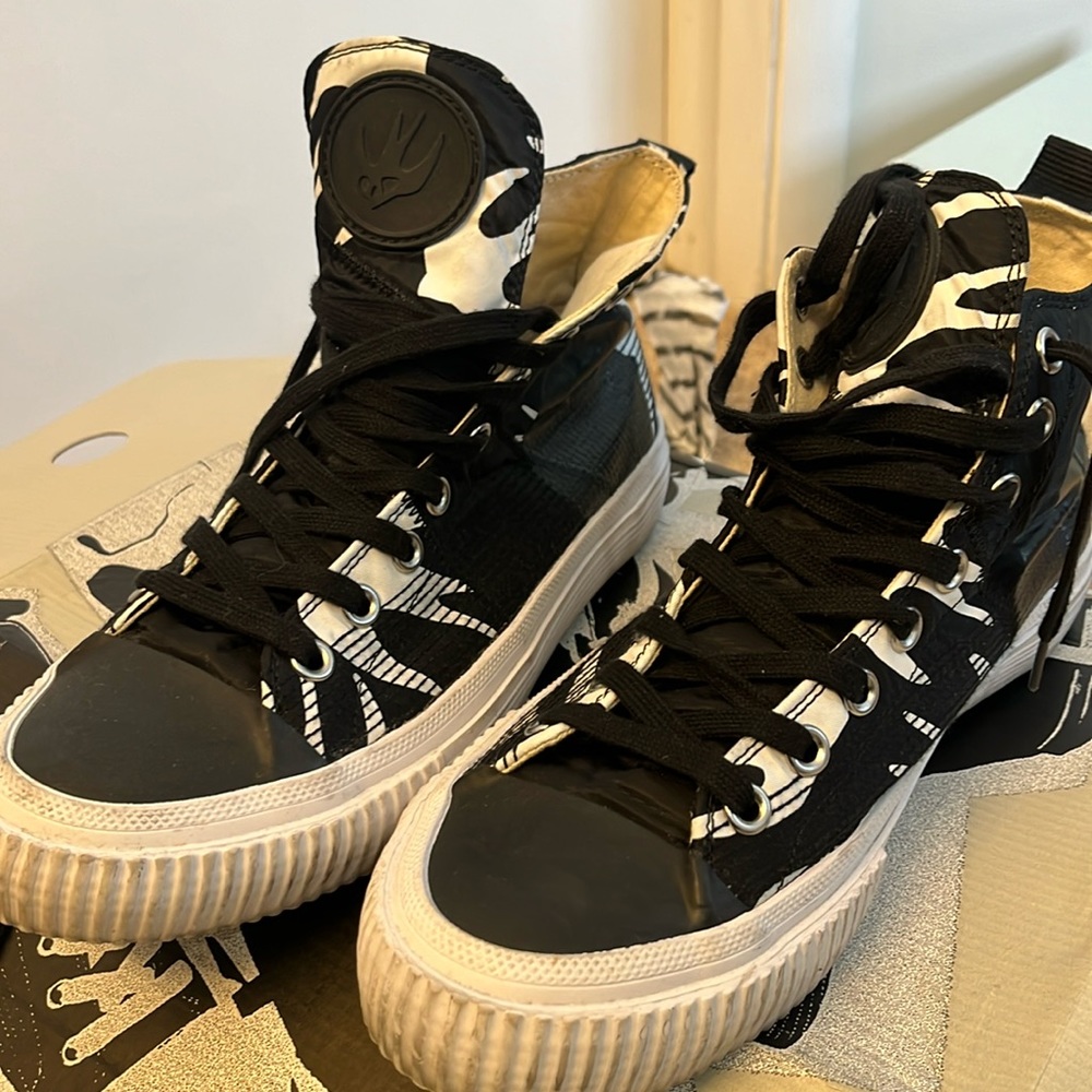 Alexander McQueen high top sneakers .. Good Condition/ lite cleaning needed.